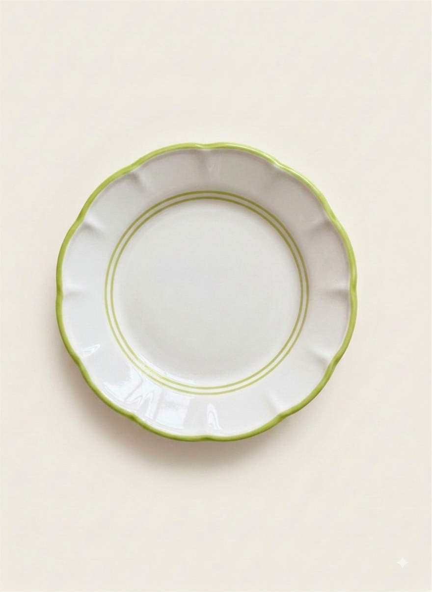 White ceramic plate with green rim line