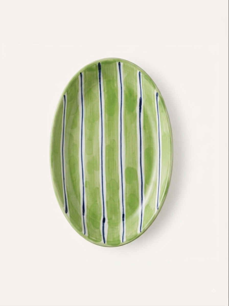 Green and navy striped oval ceramic plate