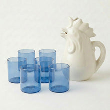 Six dark blue glass tumblers with rooster pitcher